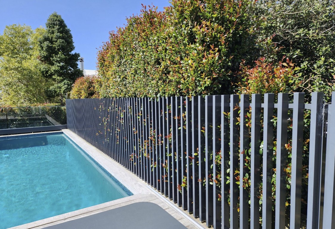 Modern aluminum pool fence meeting safety requirements for Florida homes